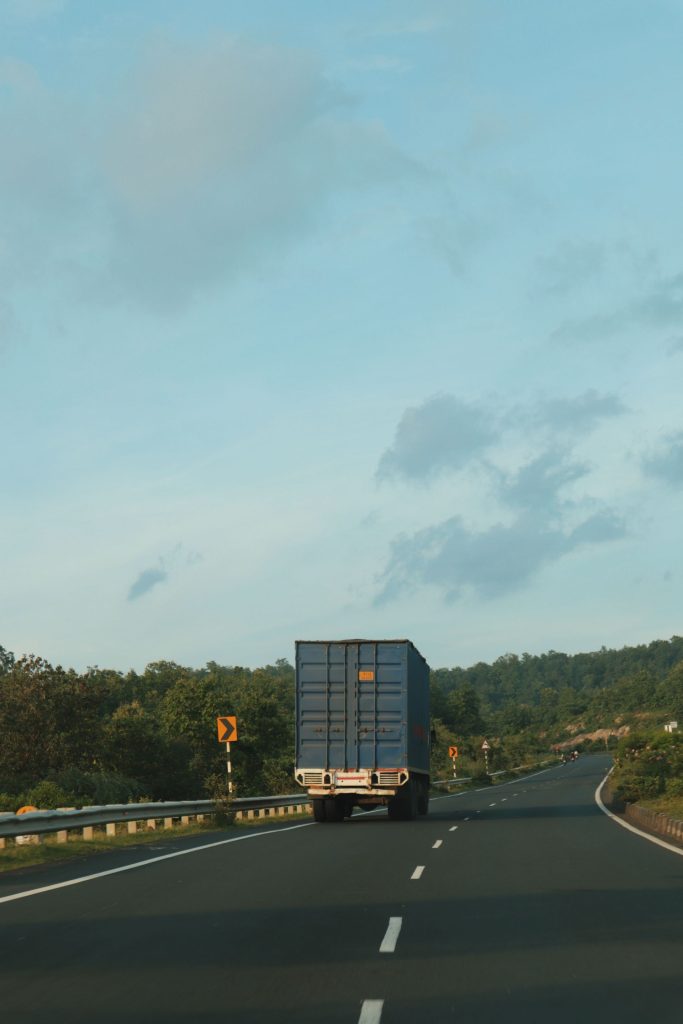 Container truck driving on an open highway